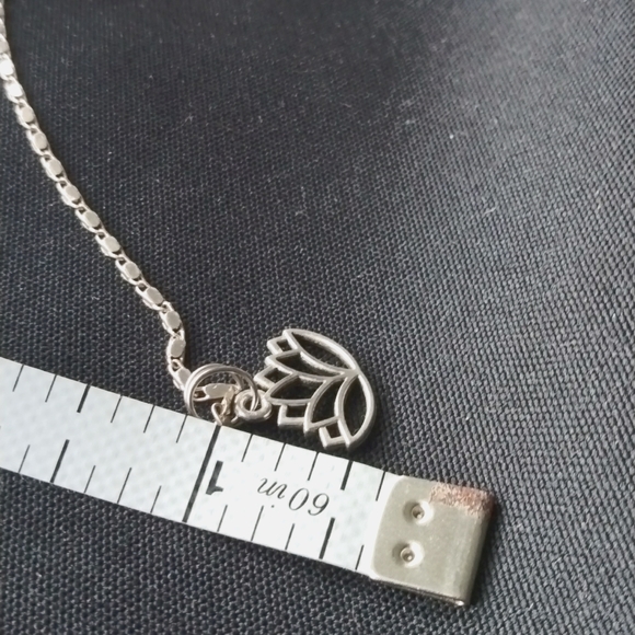 Small lotus charm on black or brown 16 to 18 inch adjustable coated cord - Picture 4 of 4